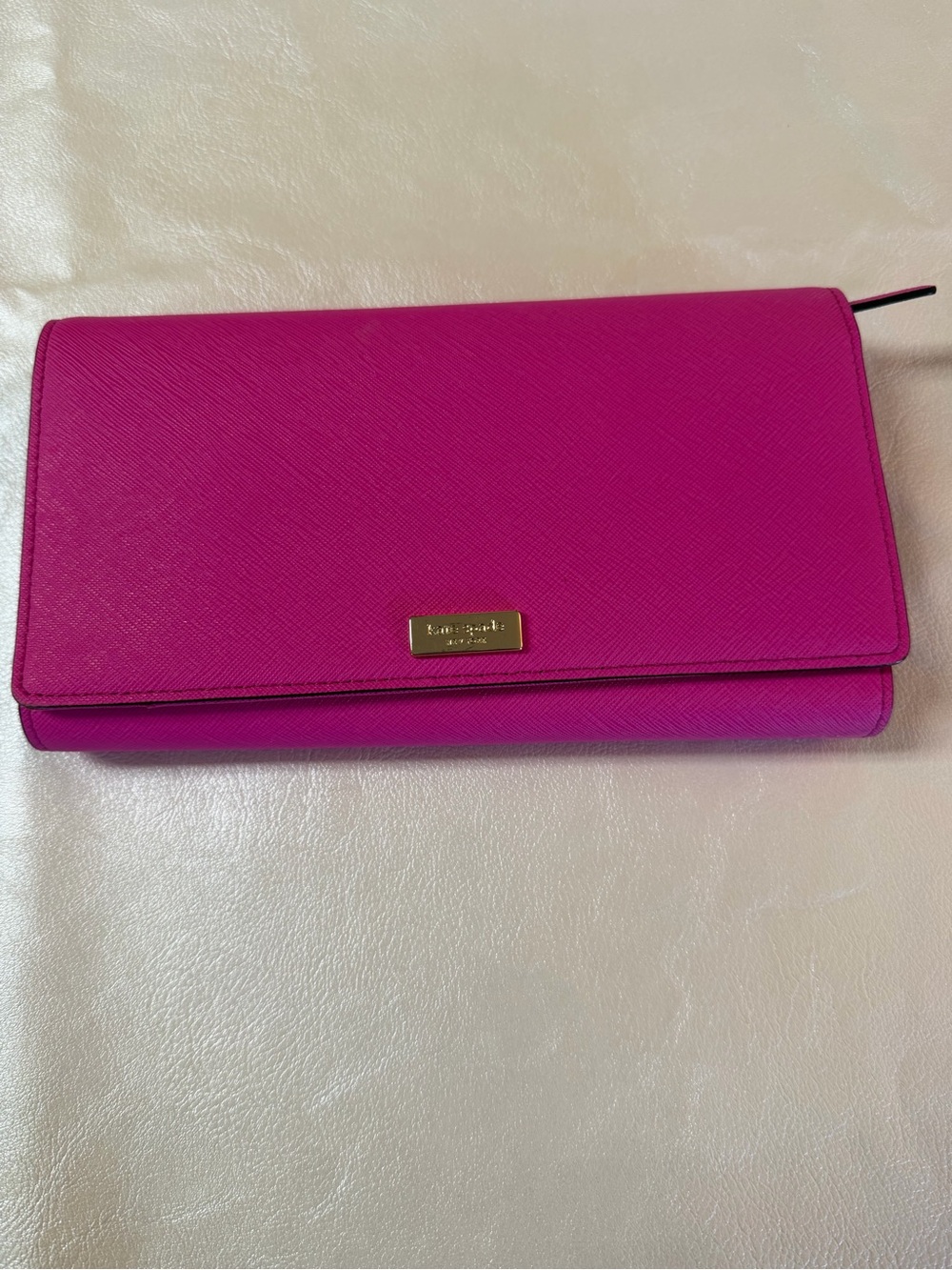 kate spade fuchsia foldover wallet with gold plaque